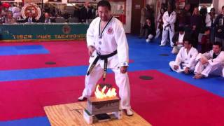 master tiger kim demonstrates how to break a flaming concrete paving brick