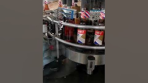 Beer bottles wet glue sticker labeling machine rotary type #bottlecappingmachine #automobile#factory