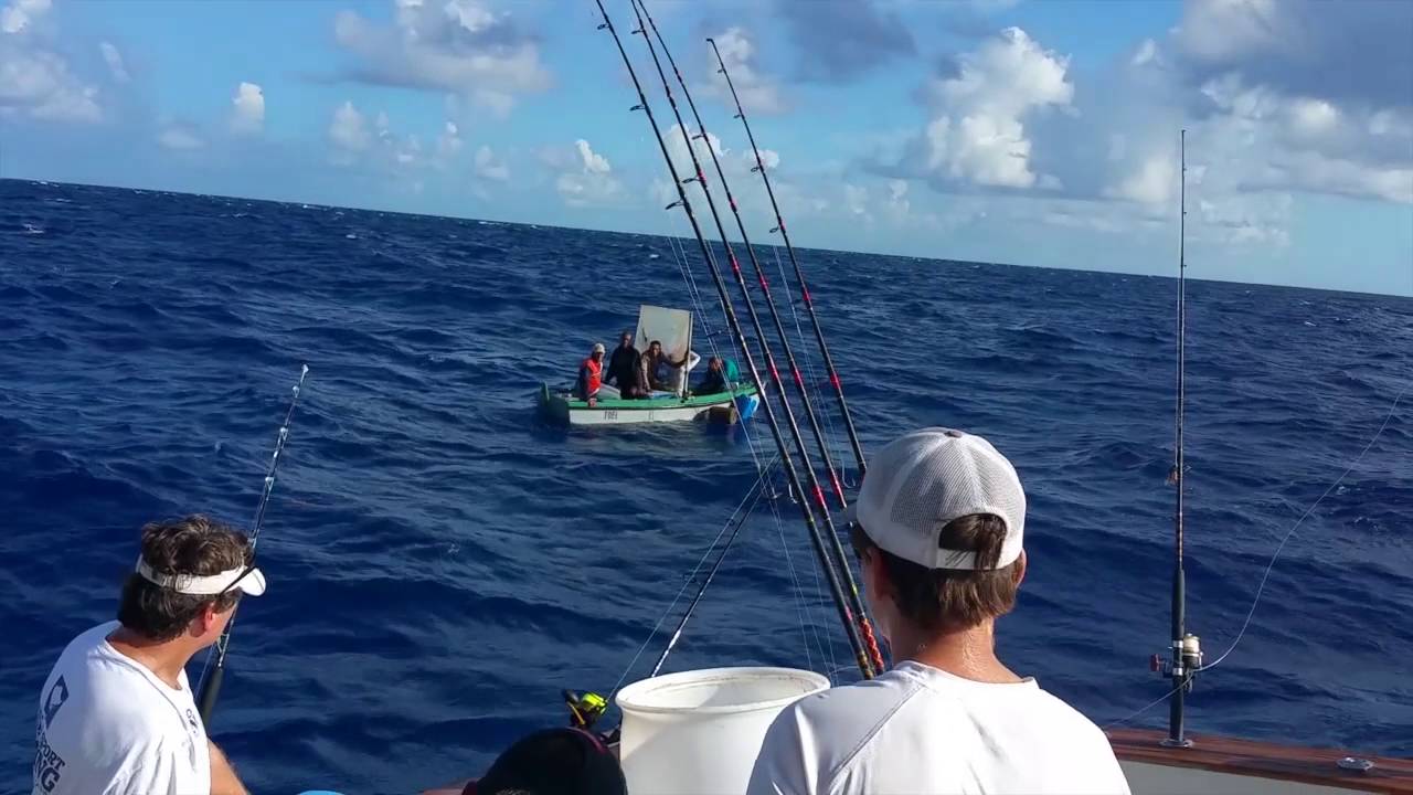 Naples fishermen help boat of Cuban refugees