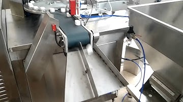 Cap wadding machine with PE liner feeder