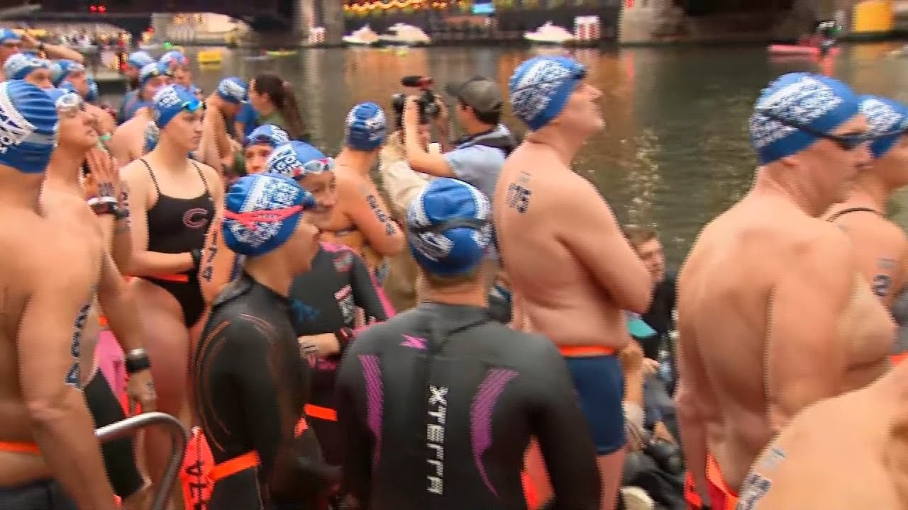 Hundreds of swimmers jump into Chicago River over the weekend