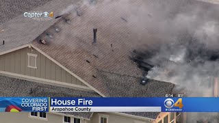 Flames Shoot Through Roof Of Burning Home