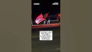 Protesters wave Nazi flags at 
