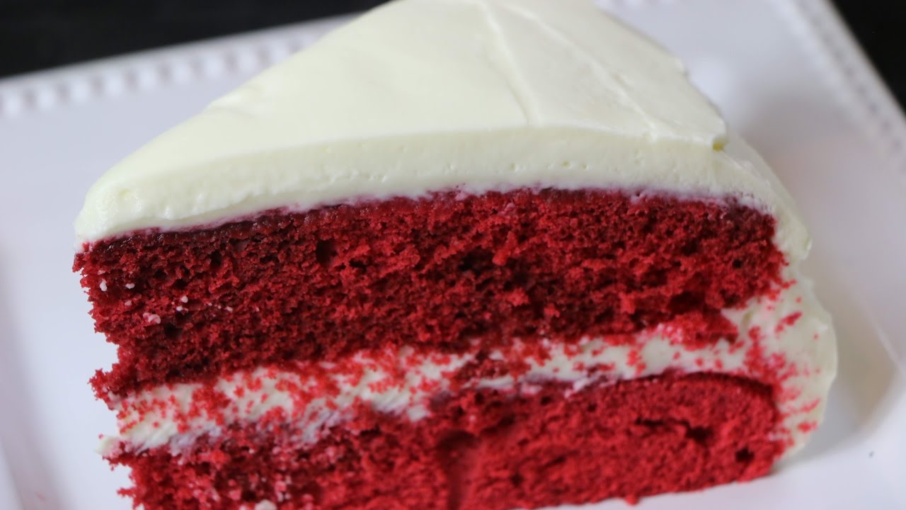 red velvet cake with cream cheese frosting and raspberries