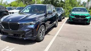 2026 BMW X5 Tanzanite Blue II Metallic with Cognac Sensafin interior walk around with window sticker