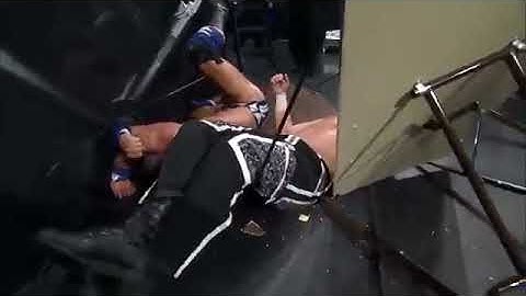 Matt Hardy leg drops EC3 through table