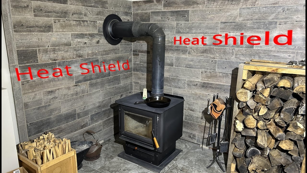 Off grid heat in a not trending tiny house  Wood stove installation and  easy heat shield 