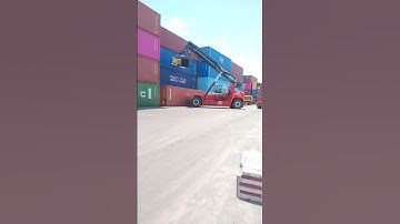 Kalmar Reach stacker with a tilting spreader for container handling