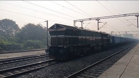 UDL WDG-4 EMD locomotive pilots covered BOXN freight train slams Prantik. 