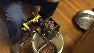 Cracking pecans with a drill