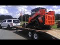 New Kubota SVL75 grading a driveway area and clearing underbrush