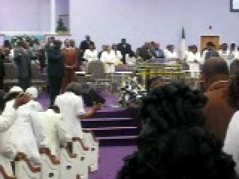 Bishop LeRoy J. Woolard praying