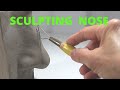 Sculpting the nose in clay sculpting in a water based clay tutorial