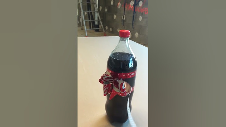 discovers the Coca Cola bottle magic trick... Coca-Cola notice bow tie