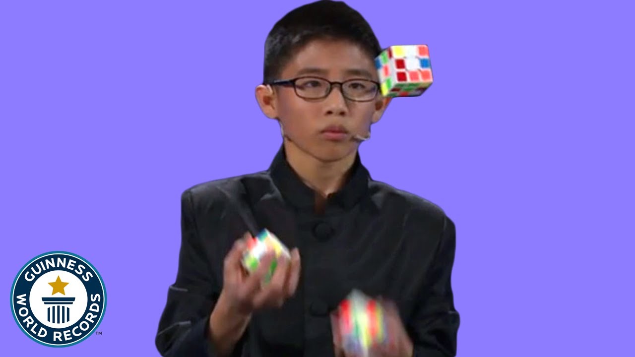 He JUGGLED and SOLVED 3 Rubiks cubes   Guinness World Records