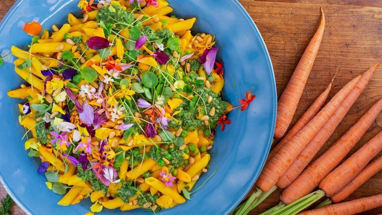 Veggie penne pasta in creamy roasted carrot sauce