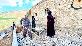 Rebuilding.  In front of the house: Hossein's efforts for his family