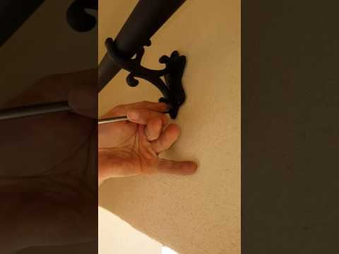 drapery-rod-center-bracket-installation-into-stucco