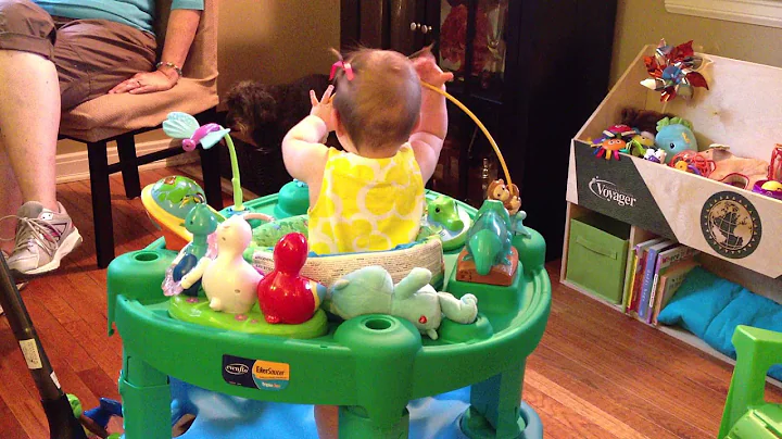 Harper, at 10 months old, puts the word "Doggie" w...
