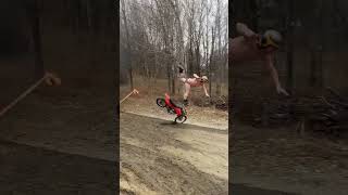 Guy in underwear jumps flaming ramp with dirt bike then bails and lands in mud