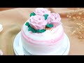 Rose garden of sweetness pastel pink cream cake adorned with three brilliant blooming roses