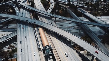 drone aerial view of a large highway road intersection in los angeles