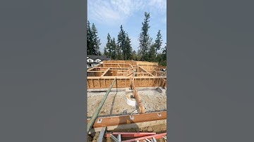 Walls and stairs up, ready for floor trusses on this custom.Petrified wood found by dirt guy#framerl