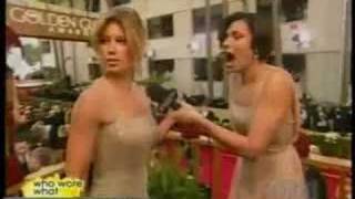 Jessica Biel pats Maria Menounos on the butt