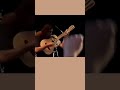 Krist Novoselic "plays" Polly on ACOUSTIC guitar.