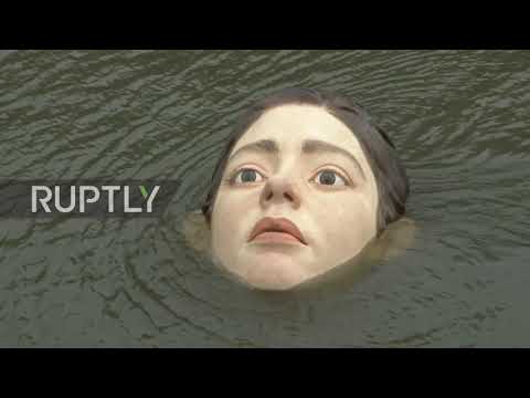 Drowning girl statue in Spain's Bilbao makes locals stop and stare