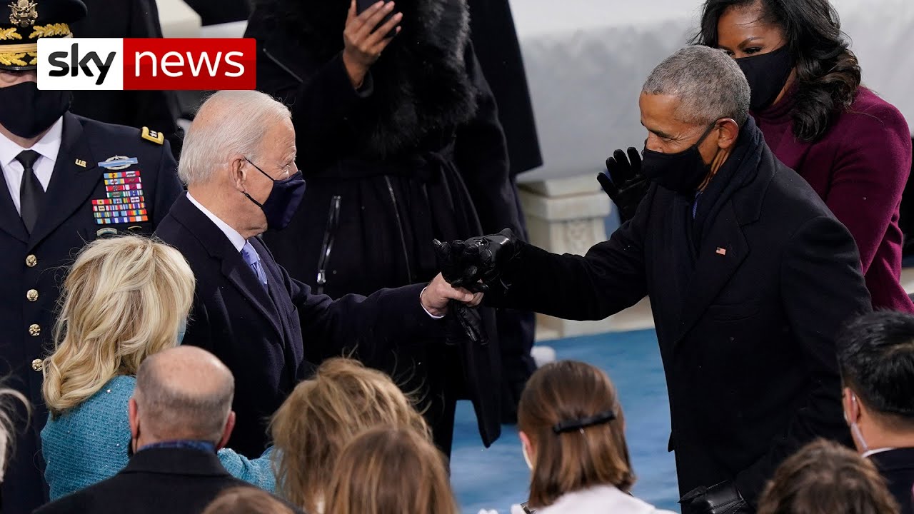 US inauguration Joe Biden walks out with his wife and fist bumps Obama