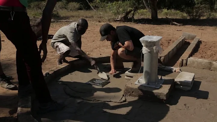 Placing the Plaque in memory of Bob and Betty Bickerstaff in Ngongane