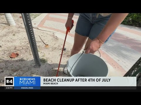 Volunteers clean up trash and debris at Miami Beach on "dirtiest beach day of the year"