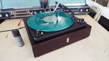Zenith 4 speed automatic record changer playing an LP record.
