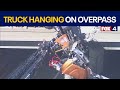 Tow truck hangs from overpass in Texas, driver rescued