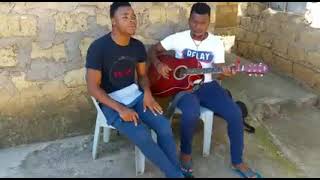 u Ntencane singing live while one playing a guitar