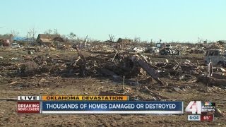 Garrett Haake surveys damage with volunteers