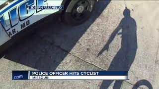 Missouri police officer distracted by phone crashes into bicyclist head on, video shows