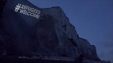 Refugees Welcome Projected on White Cliffs of Dover