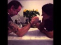 Old guy challenges female figure athlete in armwrestling