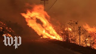 Two fast-moving wildfires continue to burn through southern
california, forcing more than 100,000 flee. subscribe the washington
post on : http:...
