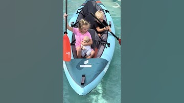 Thumbnail of Kids are floating in a kayak in the pool