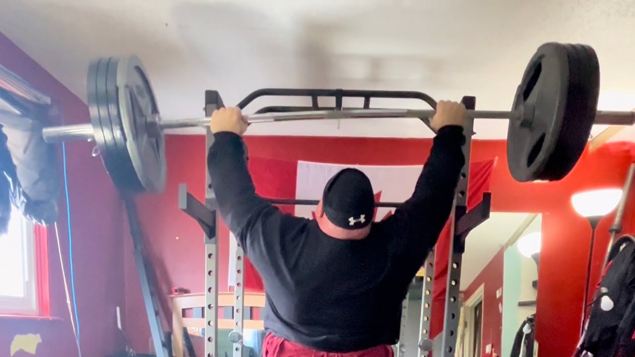 Пошаговое описание упражнения «Жим штанги над головой стоя».