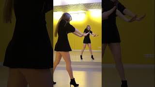 Dancing in a black short dress with high heels