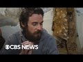 American in Syria flown out, mysterious drones in multiple states, more | CBS News 24/7