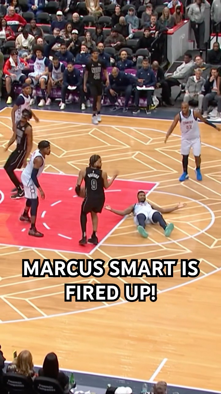 Marcus Smart draws the charge and is hyped up!