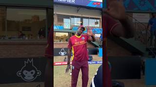 West Indies cricketer Jason Holder with Nepali players after the match against Nepal