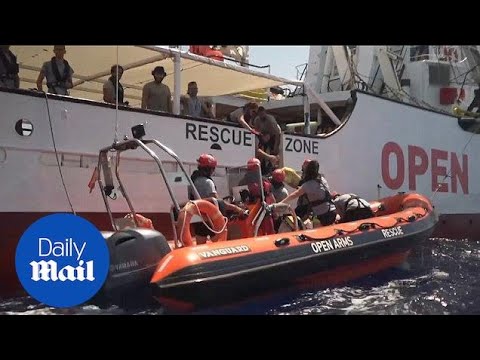 Spanish rescue group helps migrants in distress at sea - YouTube