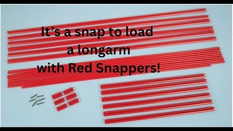 Red Snapper loading a quilt on the longarm frame. 