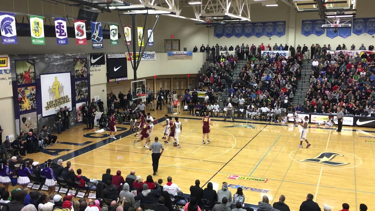 Garfield freshman PJ Fuller finishes alley oop dunk